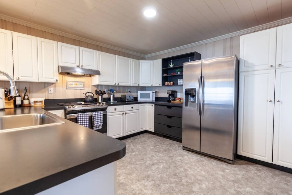 The kitchen is fully equipped with cooking, serving and dining ware.