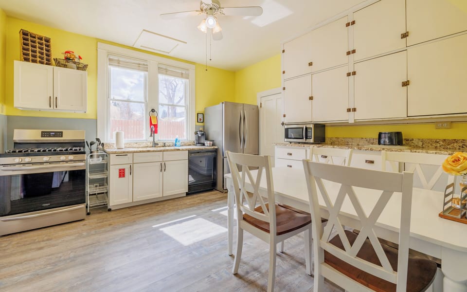 Newly installed flooring throughout the interior of the home is clean and fresh. The large kitchen with eat-in dining area makes a great gathering space
