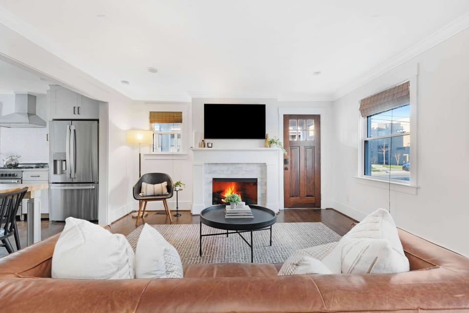 Bright open-concept living area flowing into the modern kitchen