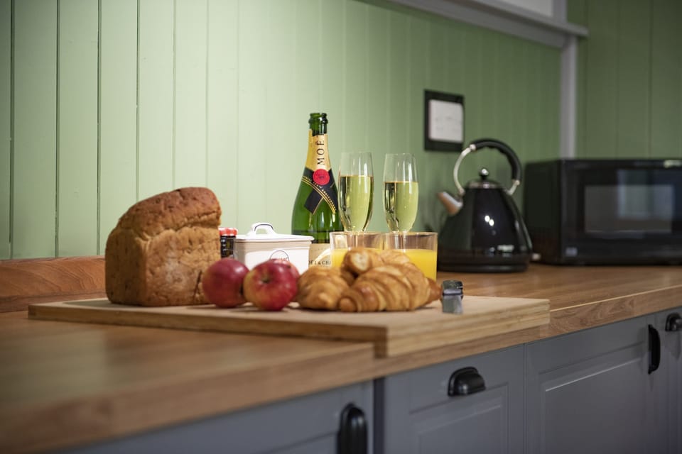 Ground floor: Delightful cottage kitchen with Belfast sink overlooking the patio area