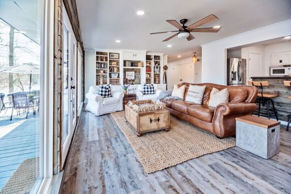 Living room open floor concept that lead to the kitchen, dining & game room