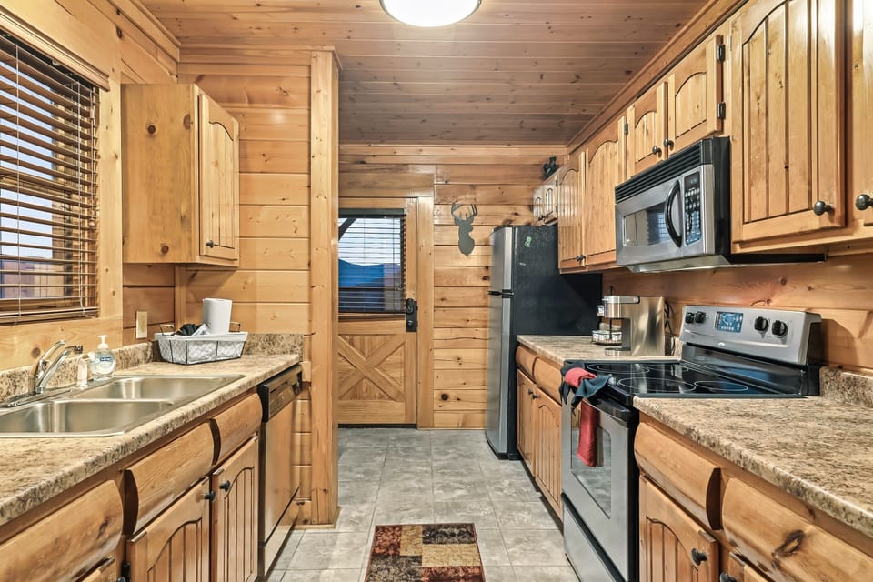 Fully stocked kitchen with Keurig, a coffee pot, a blender, and a dishwasher.