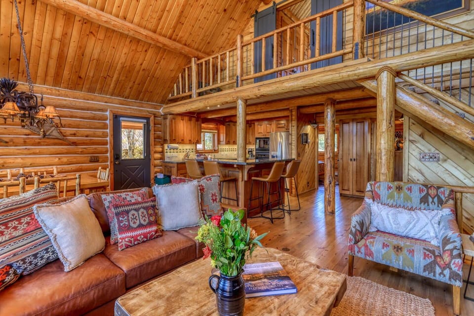 There are two queen bedrooms directly behind the living and kitchen areas as well as a large full bathroom. Upstairs is the King primary suite.