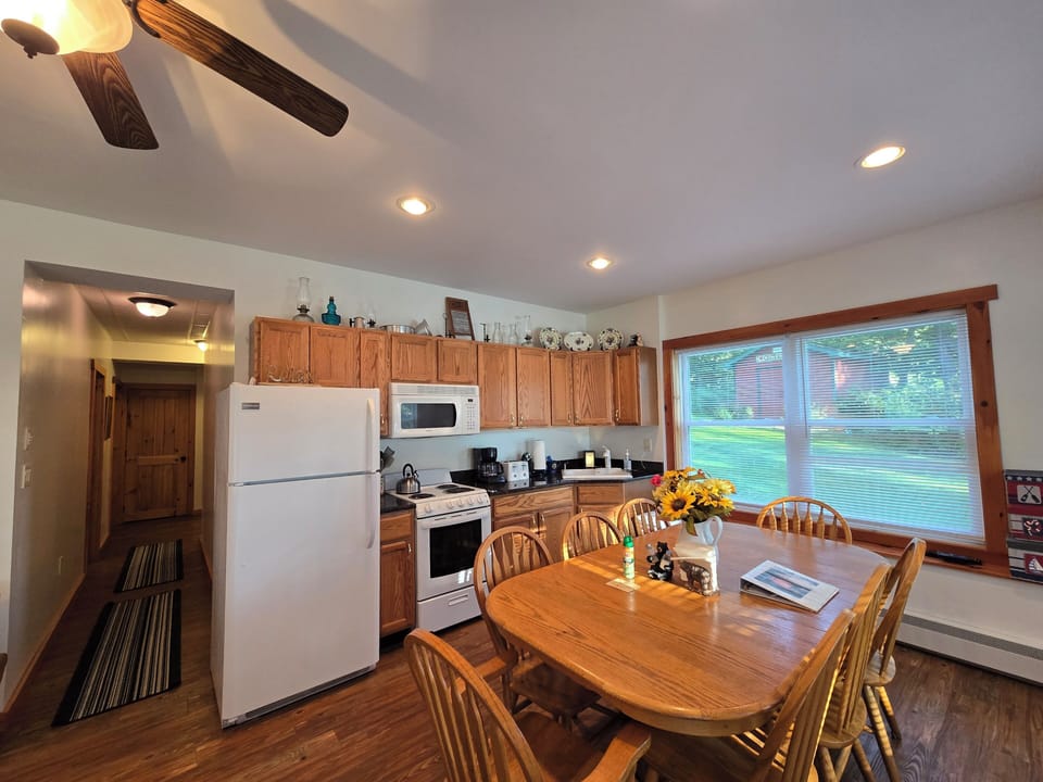 Full Kitchen w/pots, pans, utensils, plates, glassware, & condiments. BBQ grill.