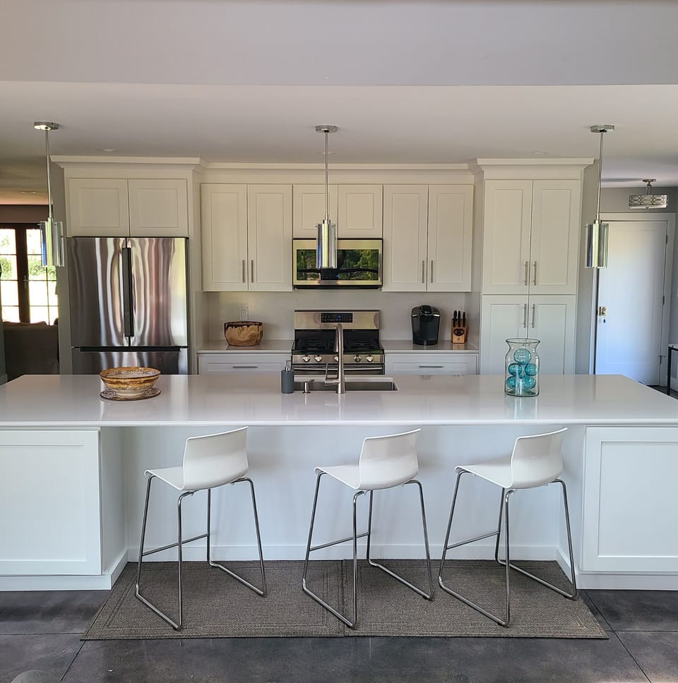 Well stocked kitchen, 14' island with seating and swivel TV