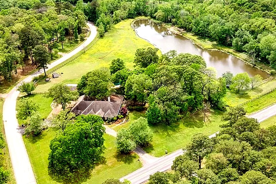 The house sits on 10-acres and includes a private 2-acre lake (w/ great fishing)