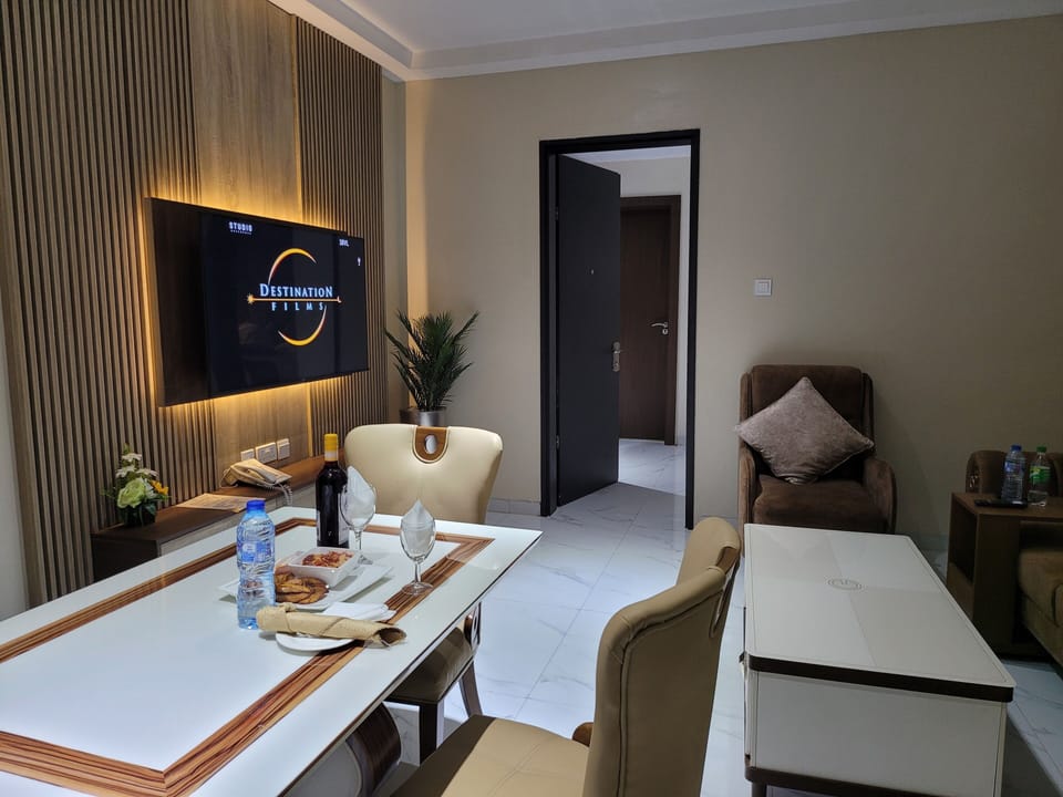 Superior Suite | Living area | Flat-screen TV