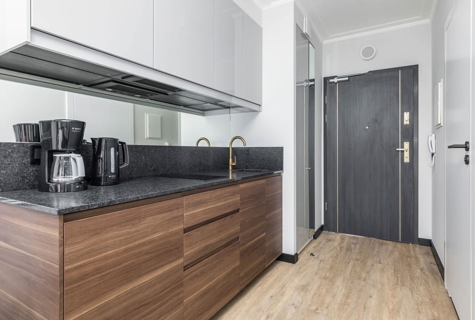 Functional kitchen with wooden cabinets and modern appliances.
