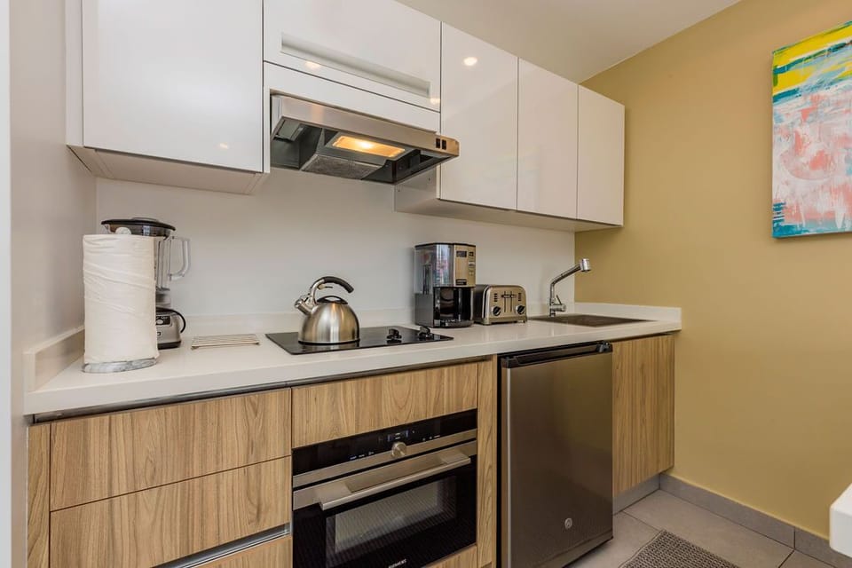 Your fully-equipped kitchen offers everything you need: kettle, coffee maker, toaster, stove, and oven—all set for preparing meals at your own pace.