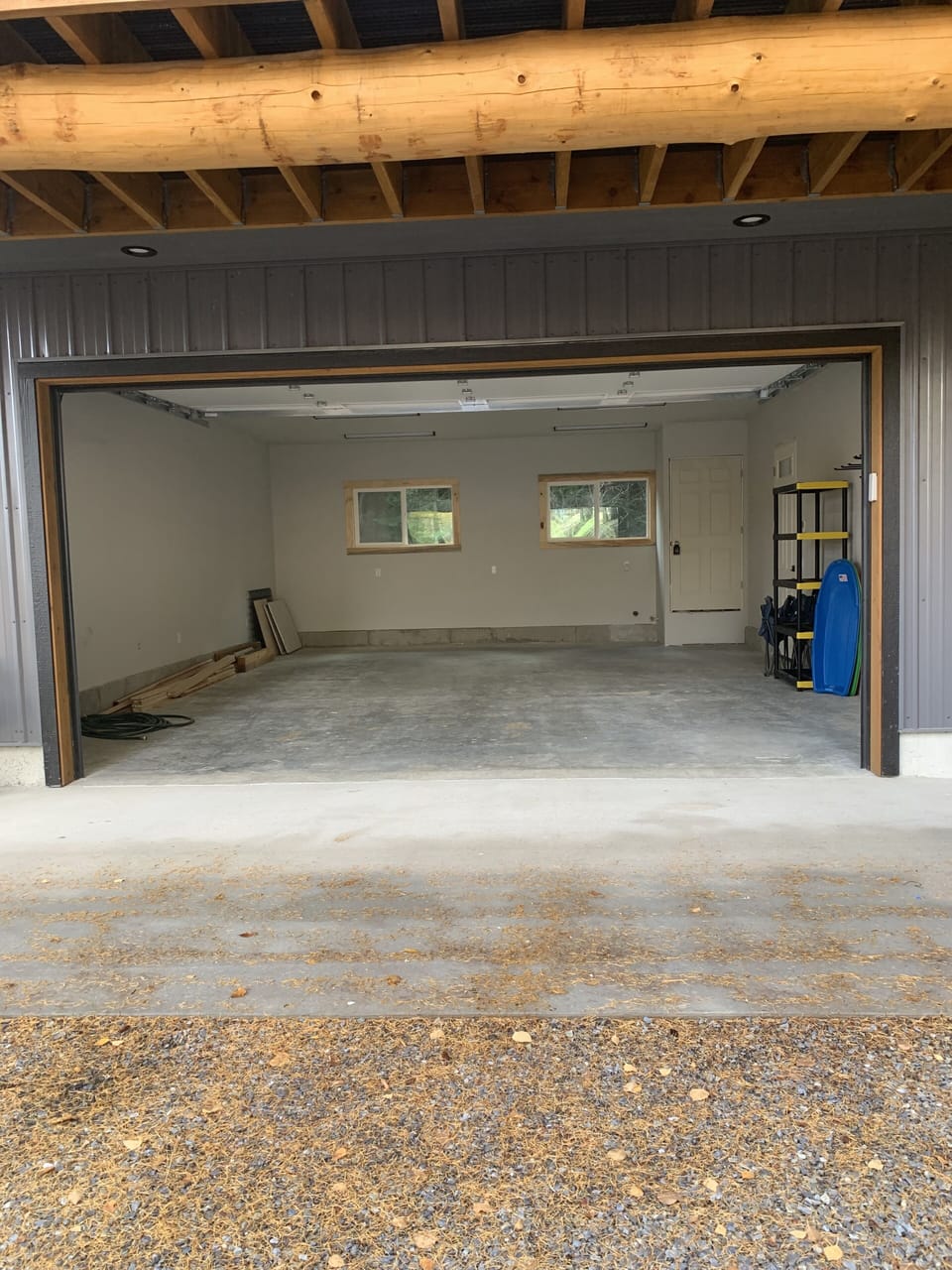 Heated two car garage and drive way with ski/snow board racks and sleds