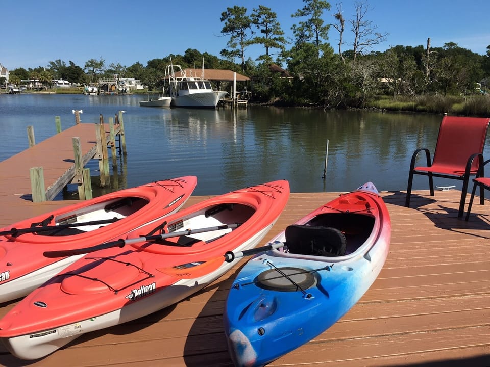 Waterfront cabin on a small estuary features a private dock and 3 kayaks & gear
