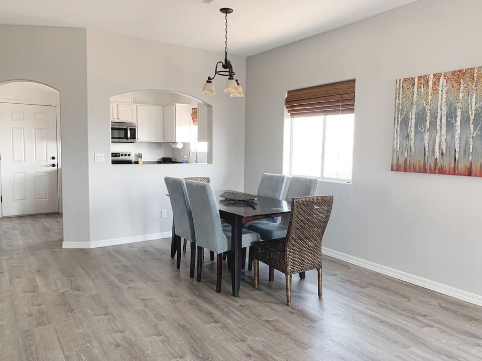 Bright dining area with seating for 6, conveniently located off the kitchen.