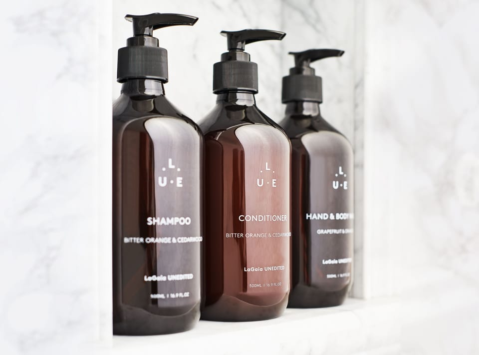 Designer toiletries, hair dryer, bathrobes, slippers