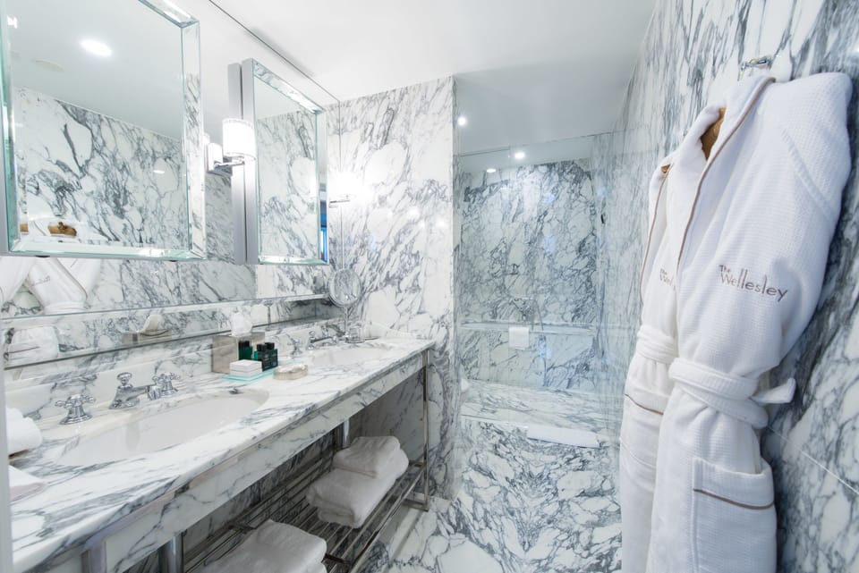 Suite, 1 Bedroom, City View | Bathroom | Designer toiletries, hair dryer, bathrobes, slippers