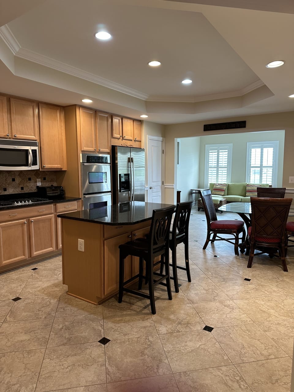 Kitchen w double oven, cooking supplies and dishes, keurig and 12-cup coffee pot