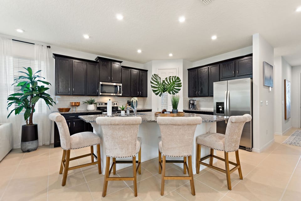 Modern fully-equipped kitchen and dining area with seating for eight