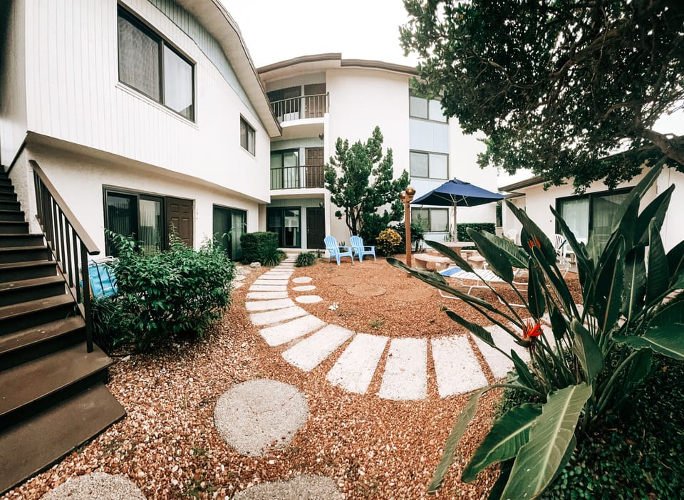 Overlooks courtyard. View designated parking spot for small to midsize vehicle