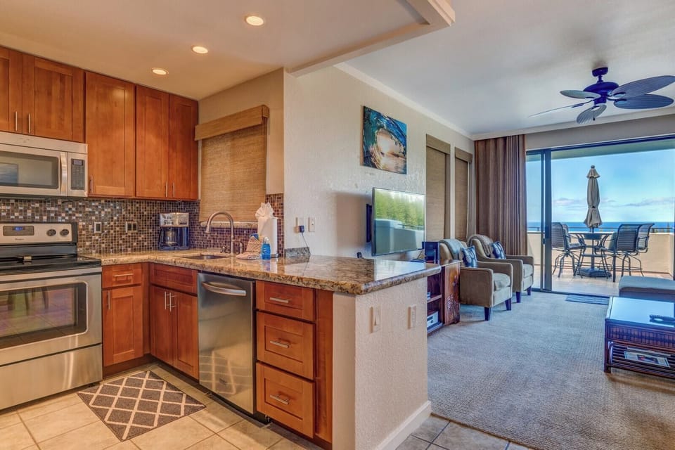 Feel the joy of preparing meals in a space that wraps you in texture, light, and a seamless connection to the ocean beyond    