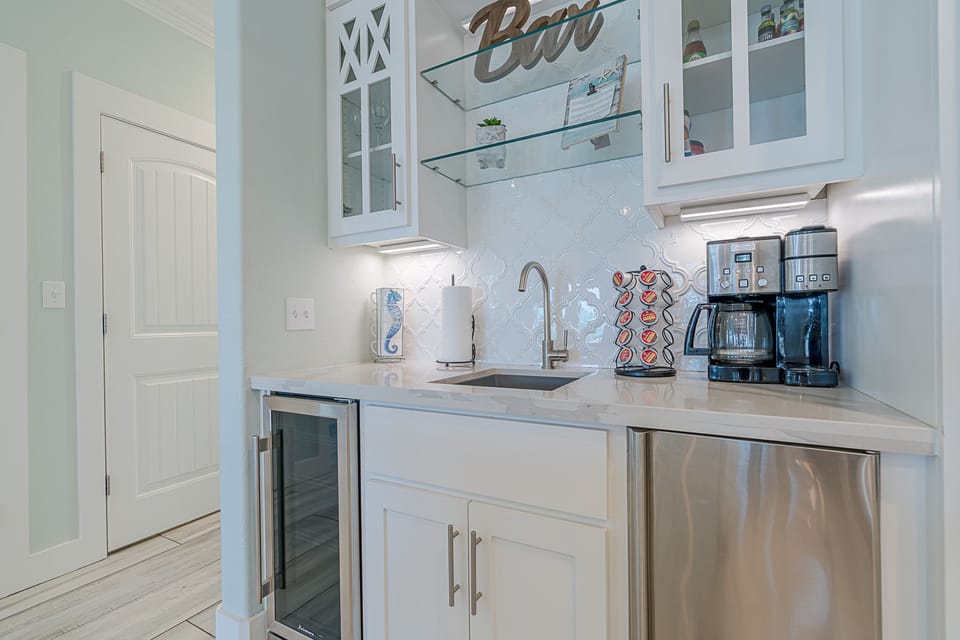 Coffee bar with wine cooler and ice maker.