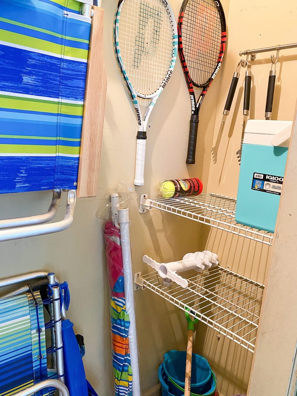 Beach umbrella , Tennis racquets and balls, BBQ utensils, cooler and much more