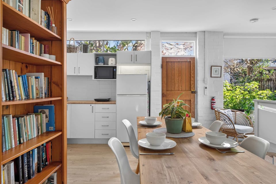 Comfortable dining area within the studio unit, featuring a dining table perfect for enjoying meals, working or relaxing in a convenient and functional space.