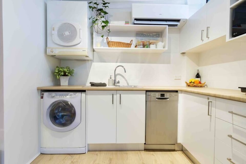 Kitchenette with dishwasher, fridge, freezer, microwave, electric cook-top, washing machine and dryer plus all of your kitchen essentials