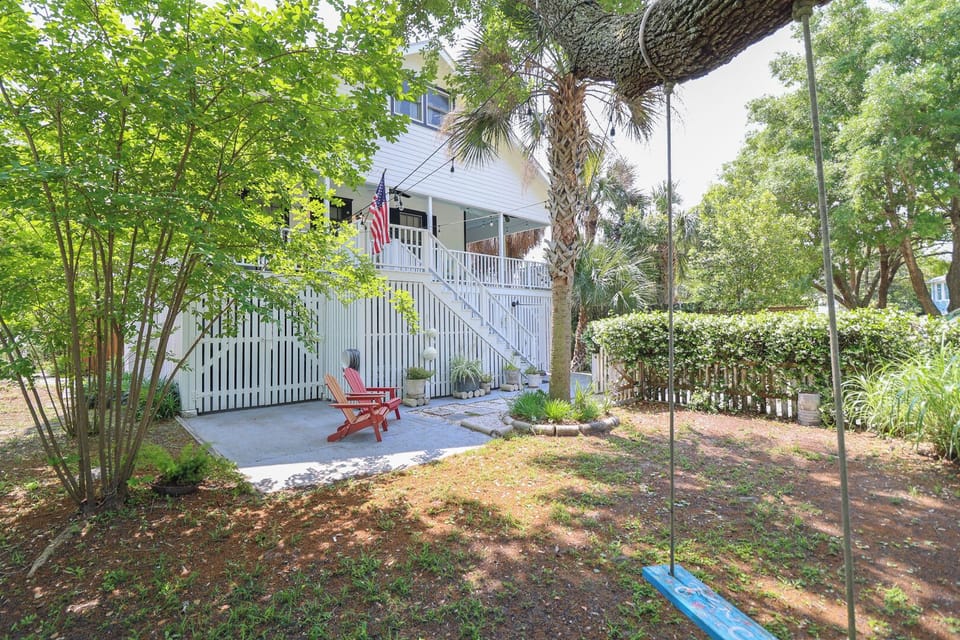 Outside view of the property with a tree swing