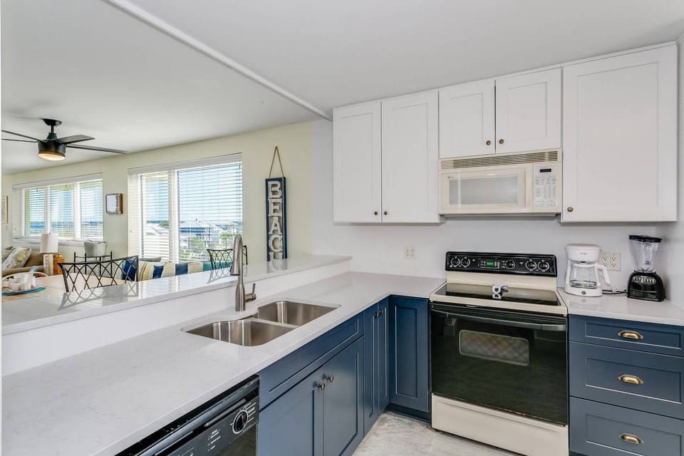 Recently updated kitchen with new cabinets and quartz countertops