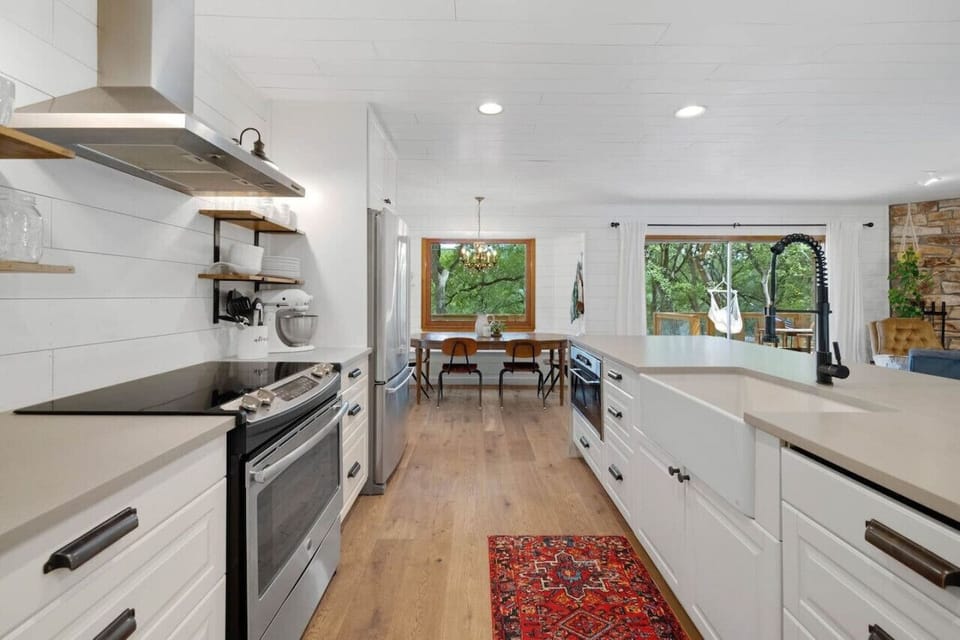 Large kitchen island with seating for four at Serenity on the San Gabriel—perfect hub for breakfast, snacks, and evening wine.