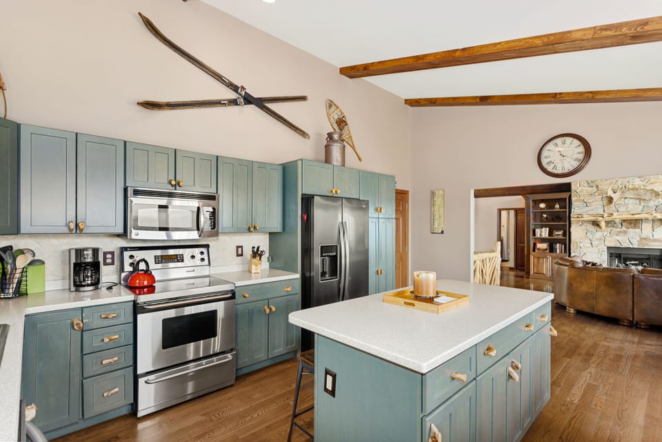 Kitchen with Stainless Appliances  and Central Island with Bar Stool Seating