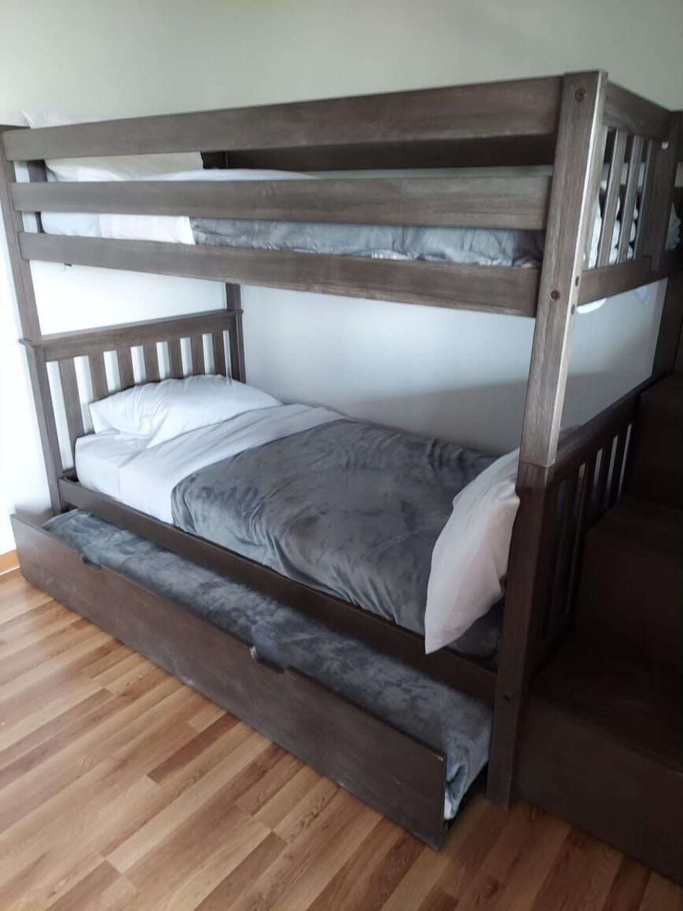 Twin bunk beds with additional pullout trundle bed
