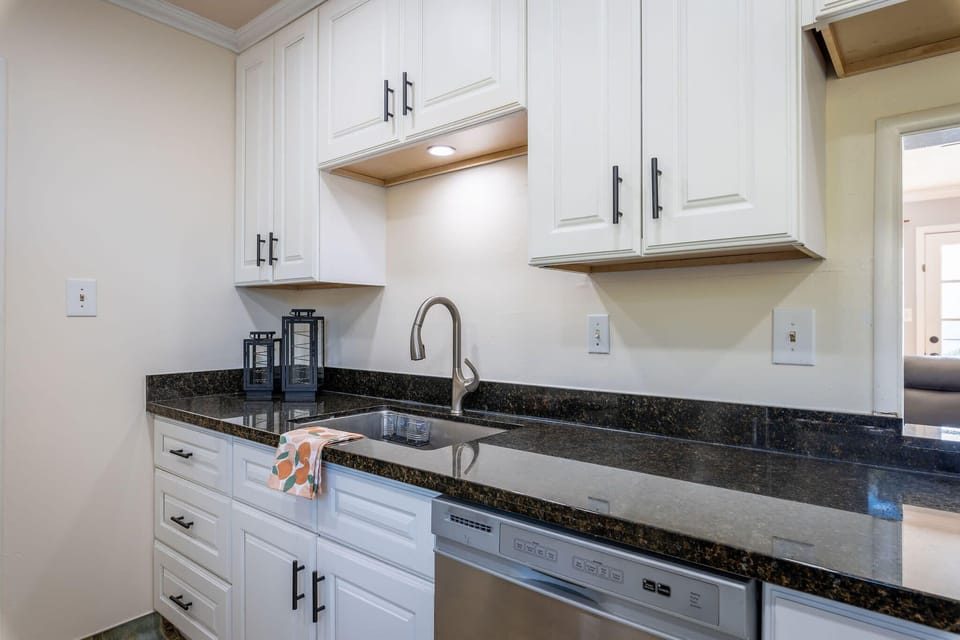 Modern kitchen sink with built-in drawers and dishwasher