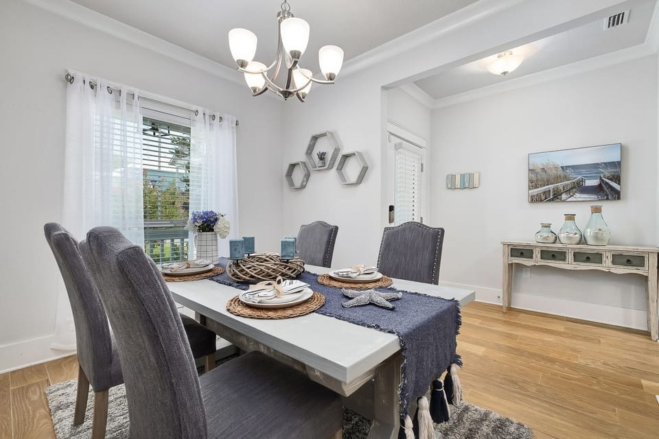 dining room off of the kitchen with a 60" bench and 4 chairs for 4-8 people