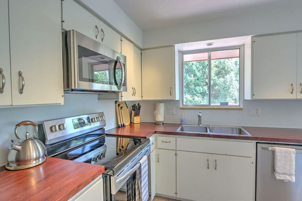 Well equipped kitchen with all new appliances and backyard views