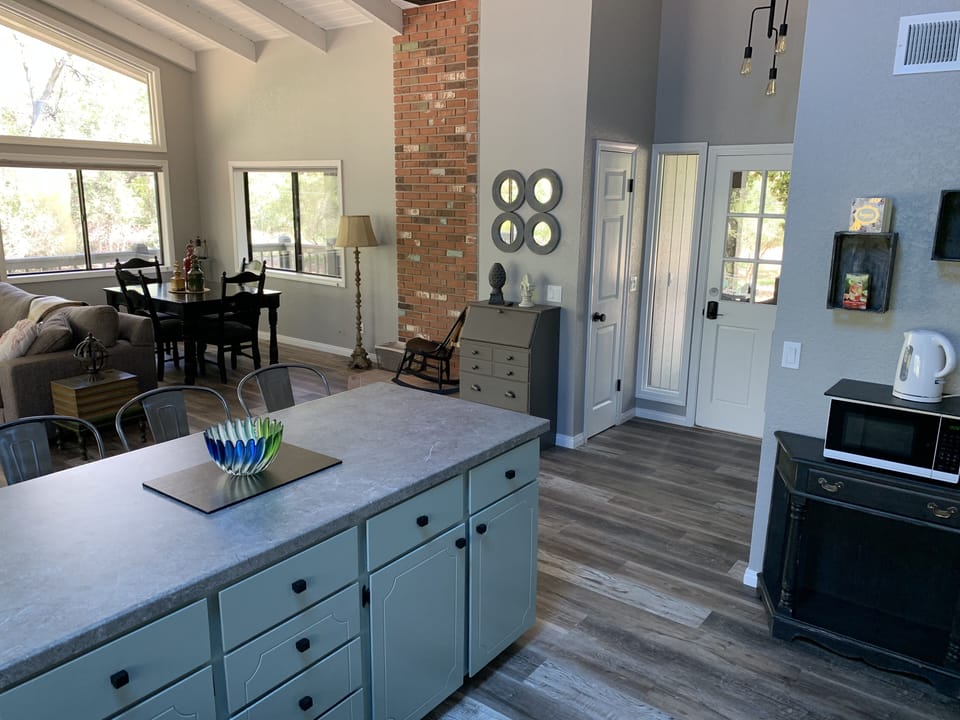Entry and kitchen with electronic door lock, new light fixtures and new flooring