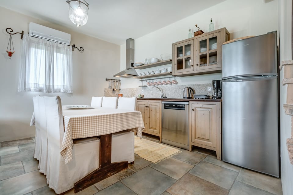 Traditional Villa | Private kitchen | Fridge, electric kettle, highchair, dining tables
