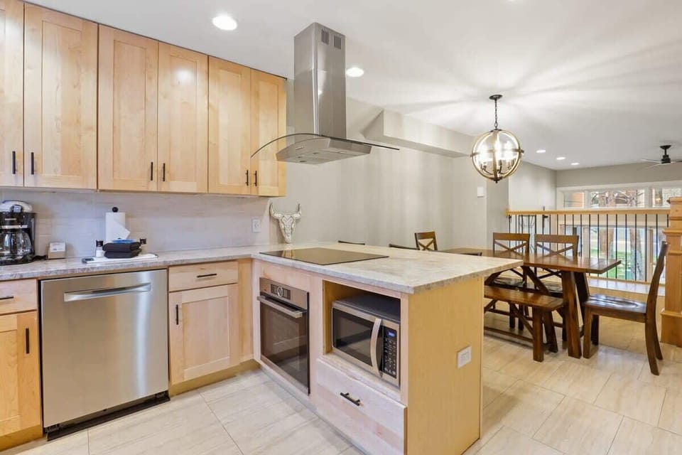 View of the fully-equipped kitchen and dining area