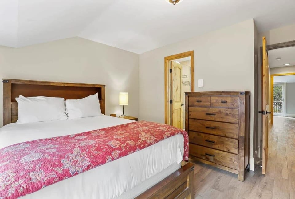 Second bedroom with a twin over full bunk bed and a queen-size bed, plus en suite bathroom