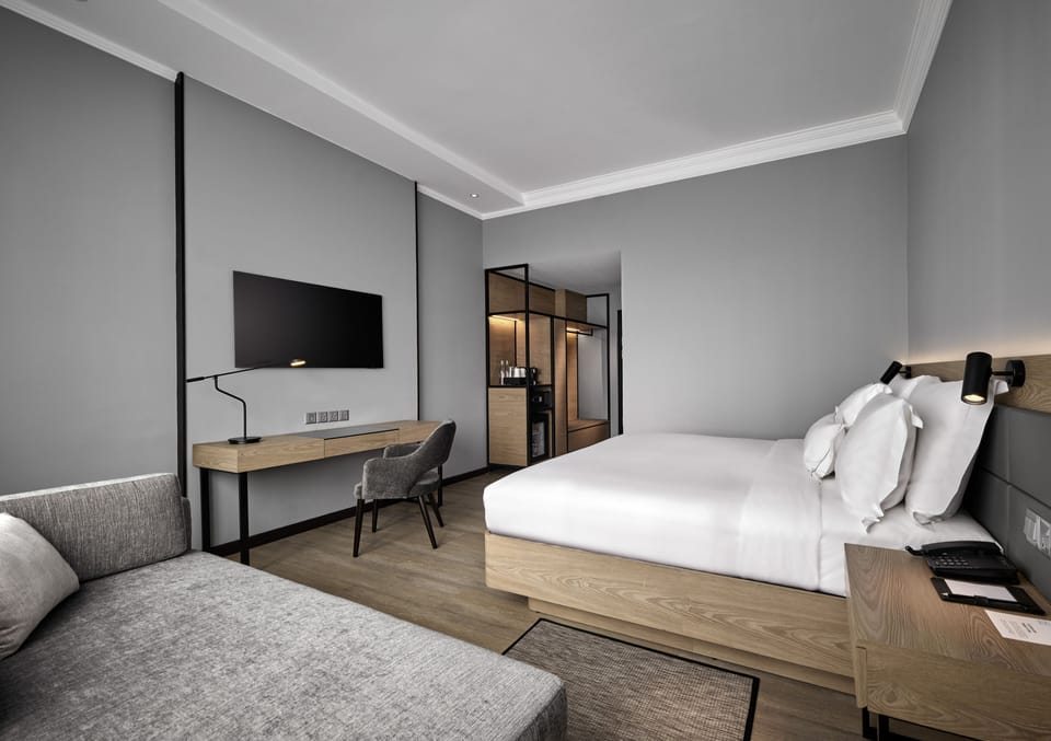 Deluxe Room, 1 King Bed with Sofa bed | In-room safe, desk, blackout drapes, soundproofing