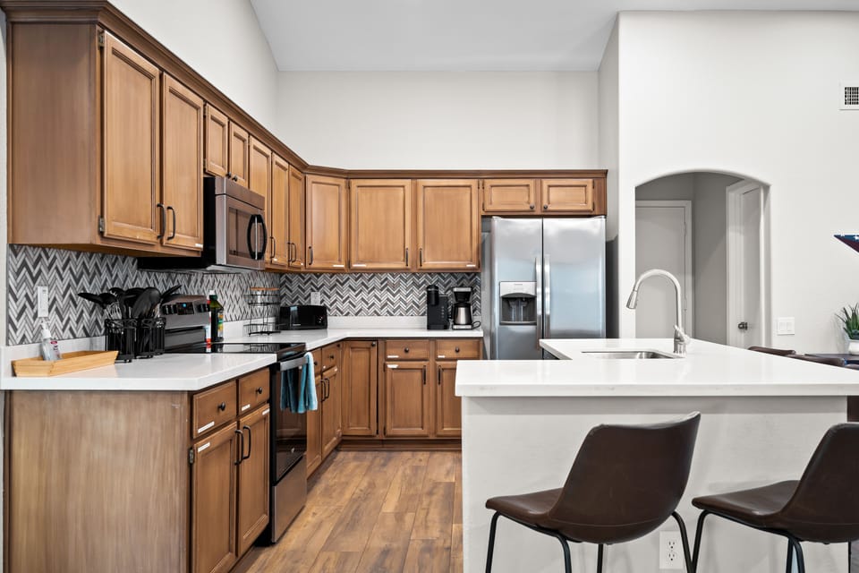 Open concept kitchen that is fully stocked to cook all your favorite meals. 