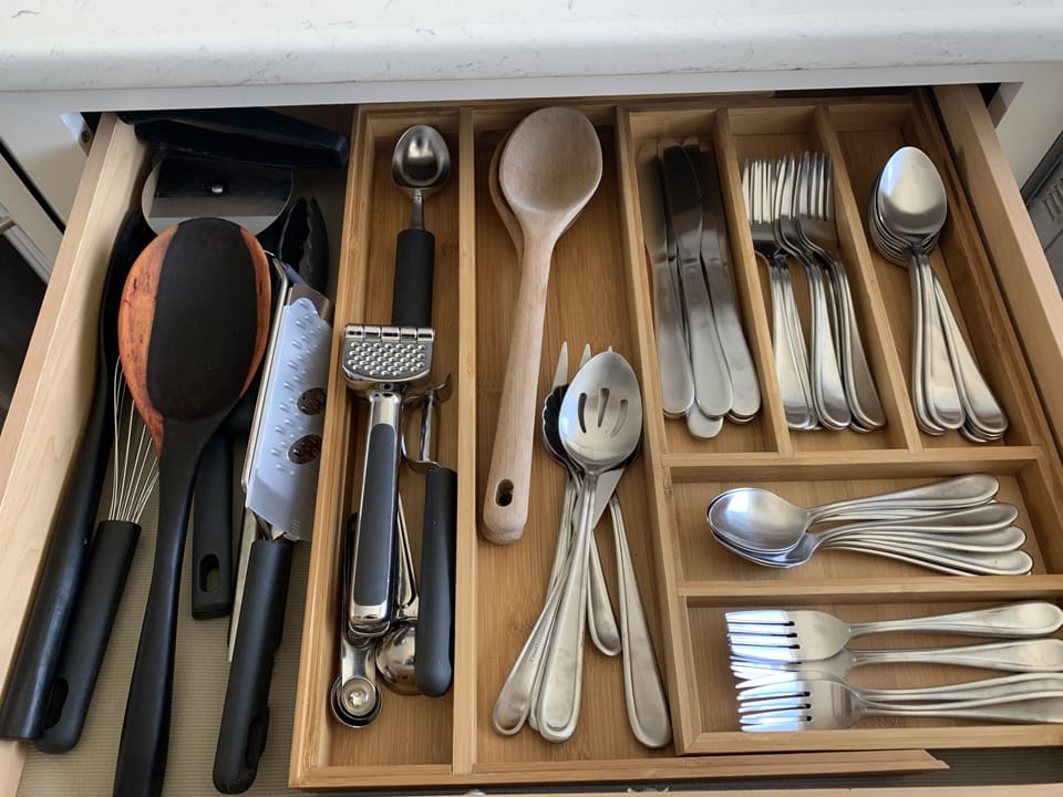 All the kitchen stuff for cooking and eating. Yes we have a garlic squisher!