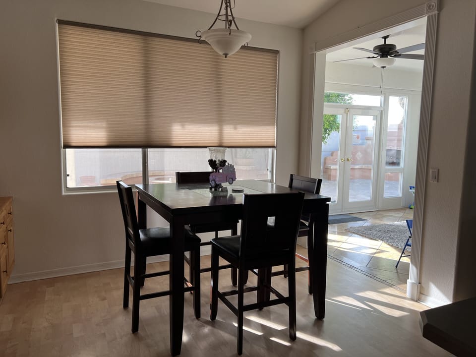 The informal dining area offers space with a beautiful view of bougainvilleas.🌺