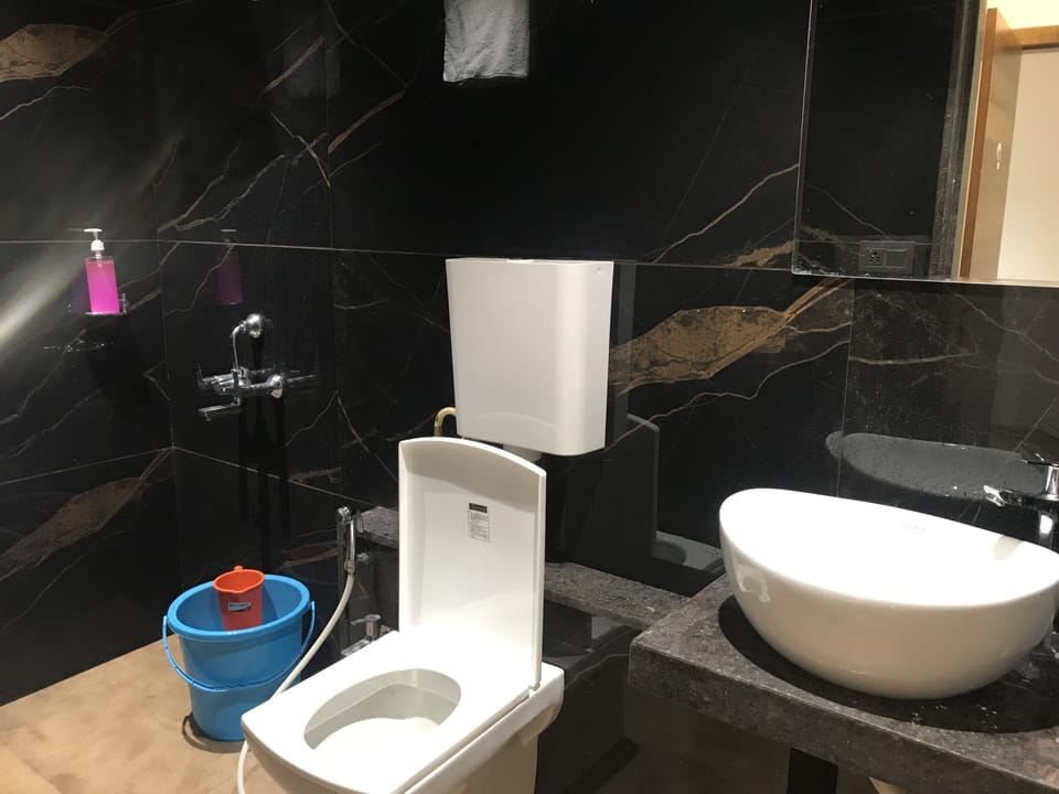 Shower, free toiletries, slippers, towels