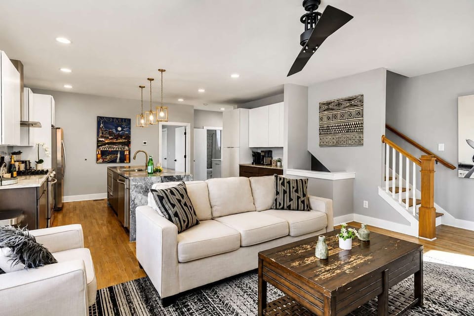 Relax on a cozy off-white sofa with stylish accent pillows after a day of exploring.