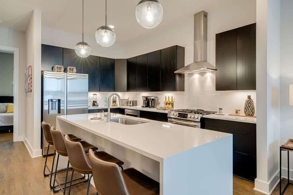 Kitchen with island seating for 4—stocked with all your cooking needs!