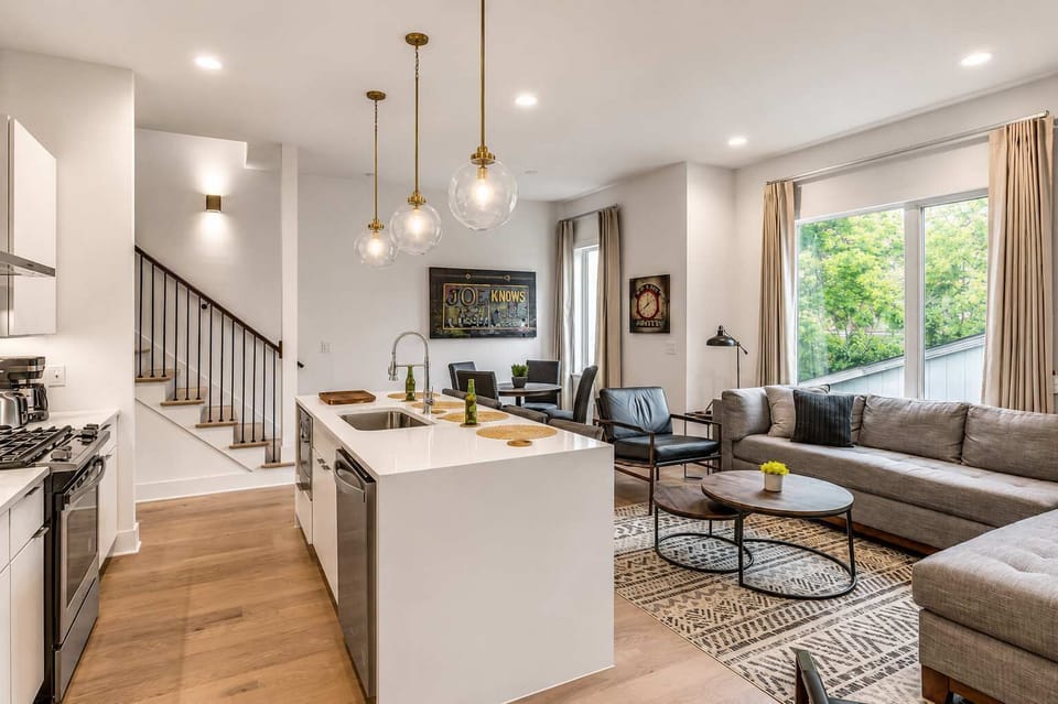 Level 2 kitchen with a central island flowing effortlessly into the living area.