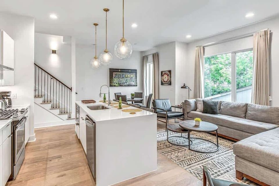 Level 2 kitchen with a central island flowing effortlessly into the living area.