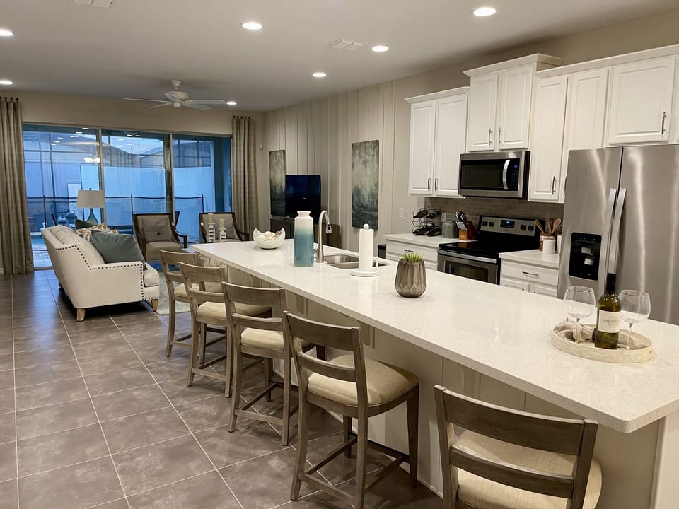 Spacious & open kitchen with plenty of seating. A welcoming space for gatherings
