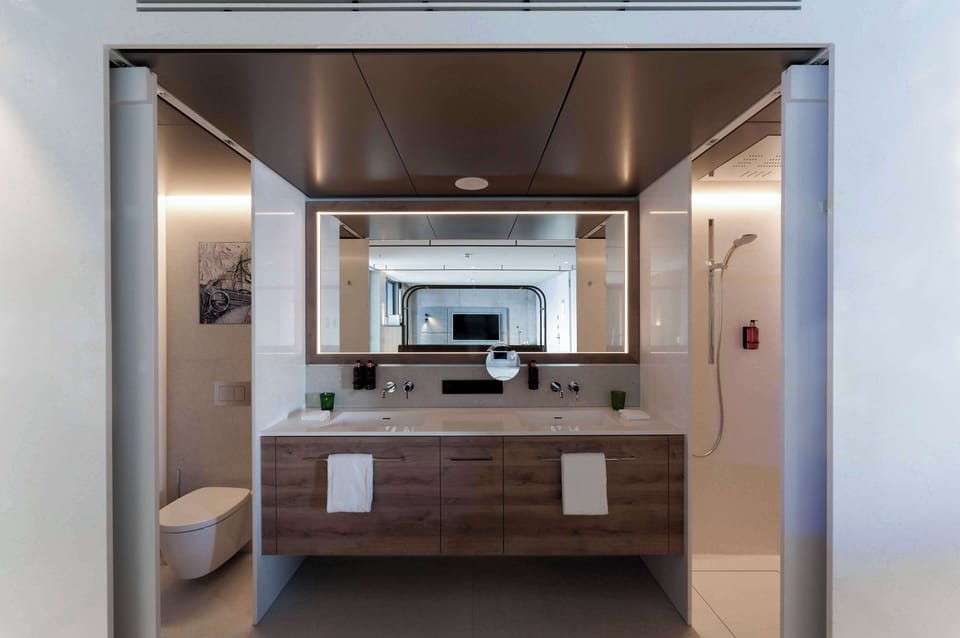 Shower, rainfall showerhead, hair dryer, towels