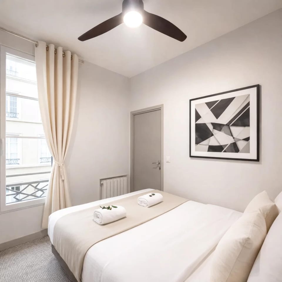 Cozy retreat with a comfortable queen-size bed and ceiling fan